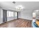 Open living area with wood flooring, bright lighting, and views to adjacent rooms at 1204 Rinkfield Pl, Brandon, FL 33511