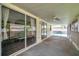 Relax on this covered patio with a ceiling fan and views of the screened pool at 1204 Rinkfield Pl, Brandon, FL 33511