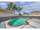 Screened-in pool with a red brick trim for seamless indoor-outdoor living and relaxing by the water at 1204 Rinkfield Pl, Brandon, FL 33511