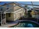 Sparkling pool and attached spa in a screened enclosure, perfect for enjoying outdoor Florida living at 1204 Rinkfield Pl, Brandon, FL 33511