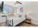 Comfortable bedroom with ample natural light, and a sleek mounted TV at 121 E Warren Ave # 4, Tampa, FL 33602