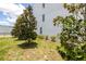 Exterior of a modern home with lush landscaping and mature trees around the yard at 121 E Warren Ave # 4, Tampa, FL 33602