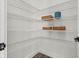 Walk-in pantry featuring metal racks, white walls and modern flooring at 121 E Warren Ave # 4, Tampa, FL 33602