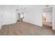 A carpeted bedroom features a ceiling fan, lighting fixtures, and entry to a closet at 1211 Stony Brook Ln, Dunedin, FL 34698