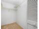 Walk-in closet features ample storage space with metal shelving and carpeted flooring at 1211 Stony Brook Ln, Dunedin, FL 34698