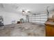 Spacious two car garage with ceiling fans, utility sink and water heater at 1211 Stony Brook Ln, Dunedin, FL 34698