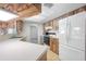 Charming kitchen with wood cabinets, white appliances, and ample counter space for meal preparation at 1211 Stony Brook Ln, Dunedin, FL 34698