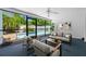 Relaxing screened-in lanai with view of the pool at 1211 Stony Brook Ln, Dunedin, FL 34698