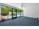 Spacious screened-in lanai with a view of the pool at 1211 Stony Brook Ln, Dunedin, FL 34698