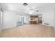 Bright and airy living area with a seamless connection to the outdoors, adjacent kitchen, and modern finishes at 1211 Stony Brook Ln, Dunedin, FL 34698
