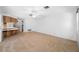 Spacious living room with adjacent breakfast bar and an open layout flowing into the kitchen and outdoor areas at 1211 Stony Brook Ln, Dunedin, FL 34698