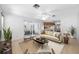 Open-concept living area with seamless flow to the kitchen and a sliding glass door leading to the outdoors at 1211 Stony Brook Ln, Dunedin, FL 34698
