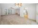 The open-concept living space includes plenty of natural light and access to the kitchen at 1211 Stony Brook Ln, Dunedin, FL 34698