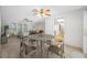 Open-concept living area with multiple seating areas and an adjacent kitchen space at 1211 Stony Brook Ln, Dunedin, FL 34698
