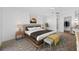 Stylish main bedroom with modern furnishings, neutral tones, and a serene atmosphere, complete with ensuite access at 1211 Stony Brook Ln, Dunedin, FL 34698
