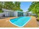 The backyard features a private pool with a deck, offering a great outdoor living space at 1211 Stony Brook Ln, Dunedin, FL 34698