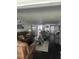 Inviting living room with comfortable leather seating, dark hardwood floors, and bright natural light at 1220 57Th N St # 103C, St Petersburg, FL 33710