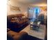 Open living space with stylish furnishings, decor, and a seamless flow to the dining area at 1220 57Th N St # 103C, St Petersburg, FL 33710