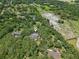 Aerial shot of property showing homes, pools and lush green trees at 12433 Kelso Rd, Thonotosassa, FL 33592