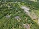 Aerial shot of property showing homes, pools and lush green trees at 12433 Kelso Rd, Thonotosassa, FL 33592