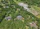 Aerial shot of property showing homes, pools and lush green trees at 12433 Kelso Rd, Thonotosassa, FL 33592