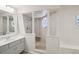Bathroom featuring a shower room with columns, a vanity with a sink, and neutral walls at 12433 Kelso Rd, Thonotosassa, FL 33592