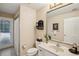 Well-maintained bathroom with neutral tones, a vanity with sink, and a shower with glass door at 12433 Kelso Rd, Thonotosassa, FL 33592