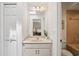 Bright bathroom with a marble countertop and an adjoining toilet at 12433 Kelso Rd, Thonotosassa, FL 33592