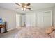 Another bedroom view showcasing carpet, closet space, and a ceiling fan for added comfort at 12433 Kelso Rd, Thonotosassa, FL 33592
