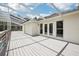 Large screened deck with white pergola extending from the home and leading to the backyard at 12433 Kelso Rd, Thonotosassa, FL 33592