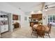 This bright dining area features wood floors, a built-in desk, and a large table for Gathering meals at 12433 Kelso Rd, Thonotosassa, FL 33592