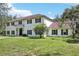 Charming two-story home with a well-manicured lawn and classic architectural details, perfect for Gathering living and outdoor enjoyment at 12433 Kelso Rd, Thonotosassa, FL 33592