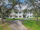Charming two-story home with symmetrical facade and mature trees at 12433 Kelso Rd, Thonotosassa, FL 33592
