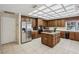 This expansive kitchen features stainless appliances, wooden cabinets, and plenty of counter space at 12433 Kelso Rd, Thonotosassa, FL 33592