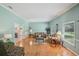 Bright living room featuring hardwood floors and crown molding at 12433 Kelso Rd, Thonotosassa, FL 33592