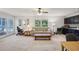 Open living room features a large window view with access to the pool at 12433 Kelso Rd, Thonotosassa, FL 33592