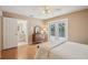 Bedroom featuring parquet floors, a connecting bathroom, and door to the outside deck at 12433 Kelso Rd, Thonotosassa, FL 33592