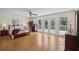 Large main bedroom with access to the outdoor balcony at 12433 Kelso Rd, Thonotosassa, FL 33592