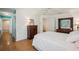 Bright main bedroom with parquet floors, turquoise accent wall, and neutral walls at 12433 Kelso Rd, Thonotosassa, FL 33592