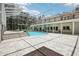 Beautiful in-ground pool and spa in screened enclosure with tile surround and ample seating at 12433 Kelso Rd, Thonotosassa, FL 33592
