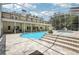 Beautiful in-ground pool and spa in screened enclosure with tile surround and large pool deck at 12433 Kelso Rd, Thonotosassa, FL 33592