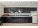The space features a wet bar with plenty of cabinet space and a mini fridge, perfect for entertaining at 12433 Kelso Rd, Thonotosassa, FL 33592