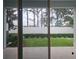 The backyard features healthy green grass, a solid fence, and trimmed hedges for privacy and style at 19643 Shady Oak Dr, Land O Lakes, FL 34638