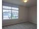 This bedroom has plush carpet and large window, offering scenic community views and lots of natural light at 19643 Shady Oak Dr, Land O Lakes, FL 34638