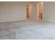 Large bedroom with neutral carpet and doorways leading to closet and bathroom at 19643 Shady Oak Dr, Land O Lakes, FL 34638
