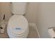 A standard, white toilet with a sanitized seat cover in a well-maintained bathroom at 19643 Shady Oak Dr, Land O Lakes, FL 34638