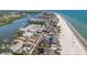Stunning aerial view of the beachfront property with the beautiful coastline at 19925 Gulf Blvd # 407, Indian Shores, FL 33785