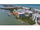 Scenic aerial view showcasing the property's beachfront location near the intercoastal waterway with dock access at 19925 Gulf Blvd # 407, Indian Shores, FL 33785