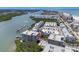 Aerial view of a condo building with waterfront access and pool at 19925 Gulf Blvd # 407, Indian Shores, FL 33785