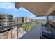 Relaxing balcony offers stunning views of the surrounding buildings and the shimmering ocean at 19925 Gulf Blvd # 407, Indian Shores, FL 33785